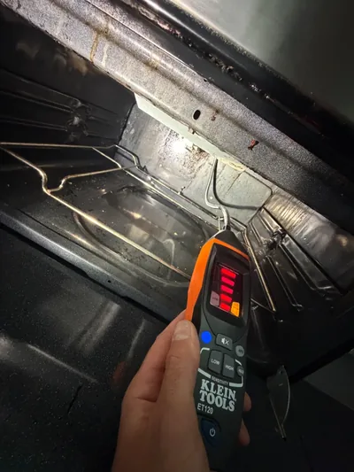 Gas leak detector inside an oven during a Denver range repair service call