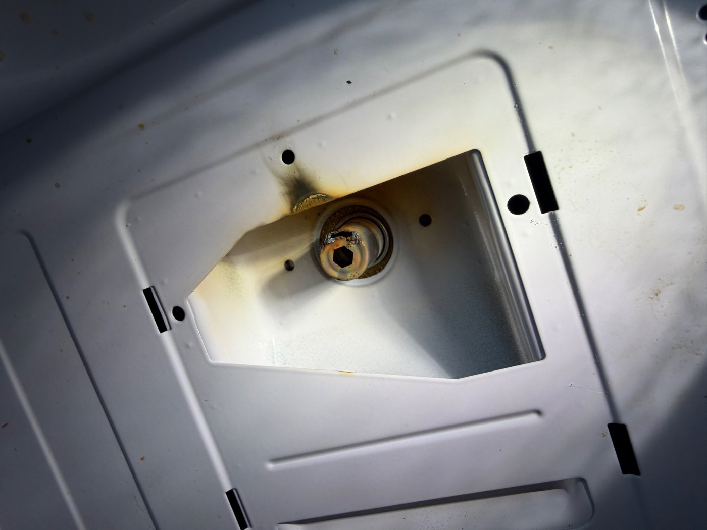 Corroded refrigerator evaporator tubing with leak evidence during a Denver refrigerator diagnosis