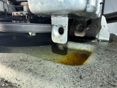Oil leak under a washing machine during a Denver service call