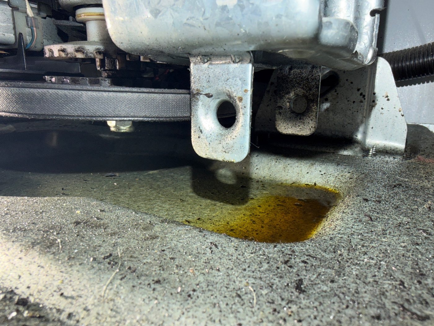 Oil leak beneath a washing machine gearcase during a Denver service call