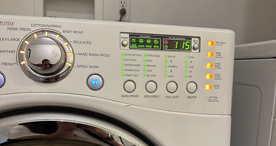 Easy Appliances Repair technician working on a washing machine in a Denver home